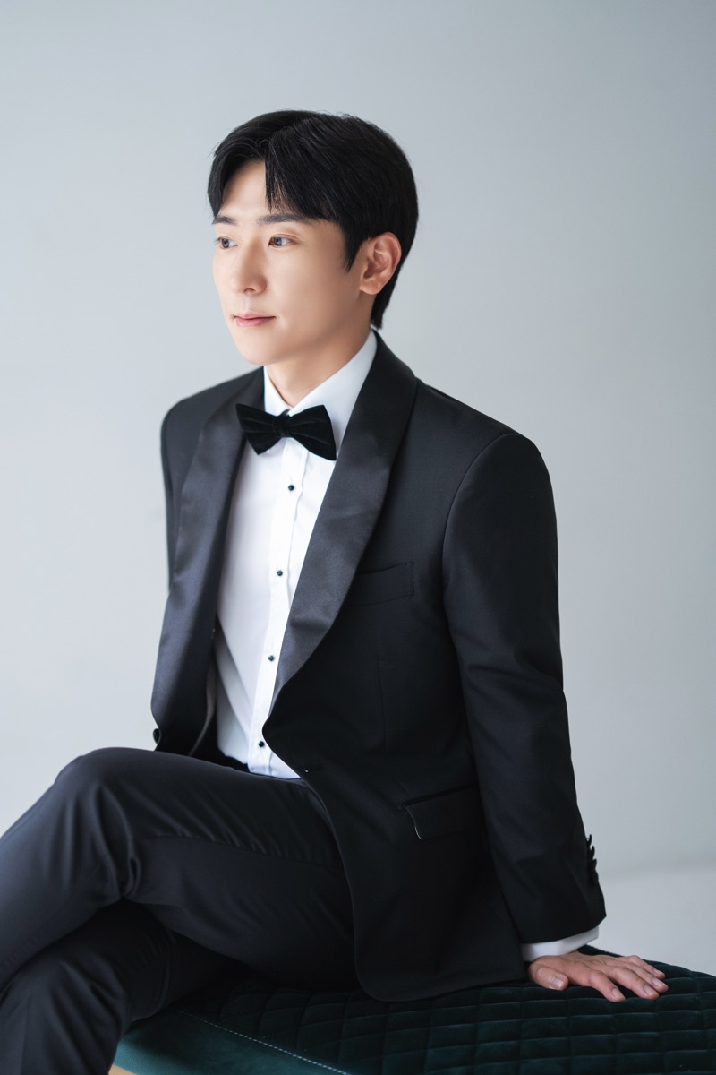 A Kavalier client in a custom evening tuxedo with satin lapels, studio portrait