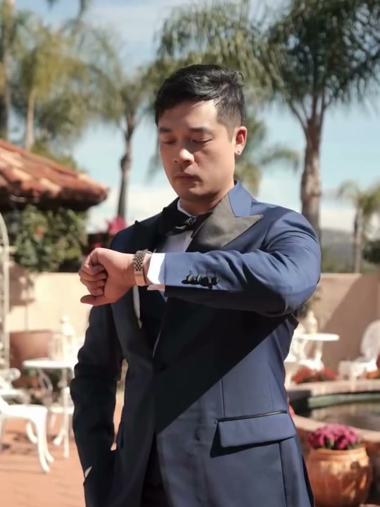 Kavalier groom in a custom midnight tuxedo at a Chicago-area villa wedding, March 2026